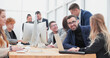 © ASDF - portrait of a happy business team at an office Desk