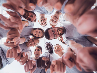 Wall Mural - bottom view. group of successful young people looking at the cam