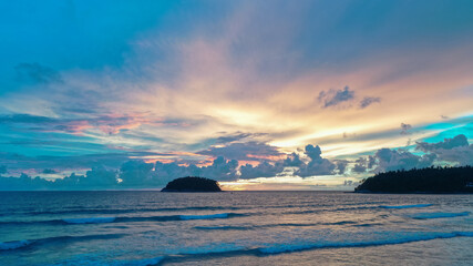 .aerial view stunning sunset above Pu island Kata beac Phuket Thailand. .Scene of colorful red light trough in the dark blue sky..Gradient color. Sky texture, abstract nature background.