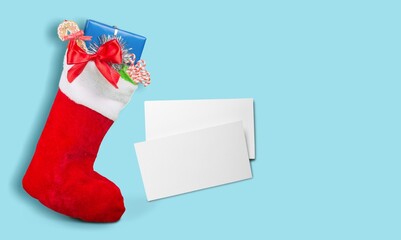 Sticker - Red boot with sweets and gifts. Minimal New Year season concept. Winter holidays idea.