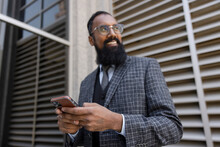 Portrait Of South Asian Businessman On Phone