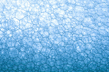 Wall Mural - Blue biotechnology texture,Transparent blue abstract molecule model over blurred blue molecule background. Concept of science, chemistry, medicine and microscopic research.