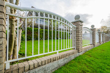 Fence Built From Painted Iron. Outdoor Landscape. Security And Privacy Concept. Vancouver. Canada.