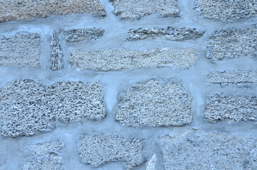 Poster - A closeup of a white stone wall