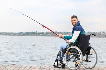 Poster - Man in wheelchair fishing on river