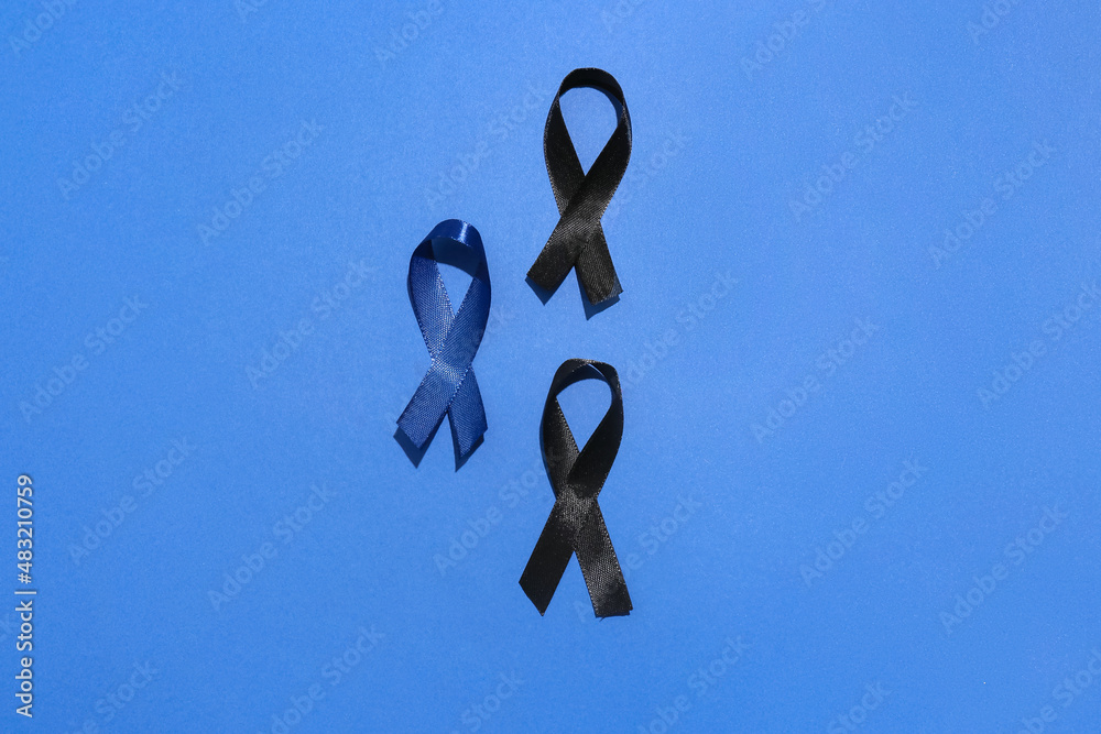 Different awareness ribbons on blue background. World Cancer Day