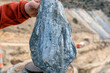View of the graphite specimen. It is a crystalline form of the element carbon with its atoms arranged in a hexagonal structure. It occurs naturally in this form and is the most stable form of carbon.
