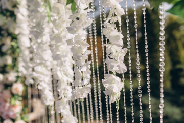 Details. Wedding ceremony in the open air of fresh flowers. Gentle and beautiful wedding decor for newlyweds