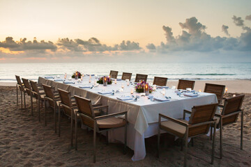 long dinner table on the beach.