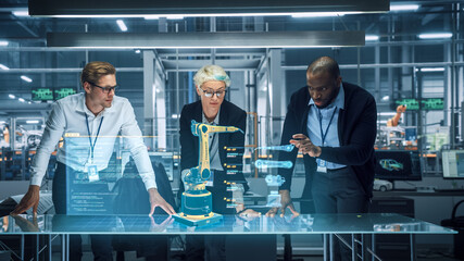 Leinwandbilder - Industry 4.0 High-Tech Factory: Diverse Team of Robotics Engineers Working on Robot Arm Design, Using Augmented Reality Hologram to Manipulate 3D Model by Gestures. Engineering with Digital Technology