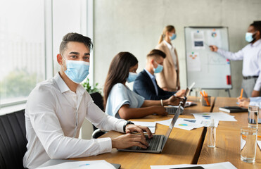Poster - Arab Male Employee In Face Mask Attending Corporate Business Conference With Colleagues