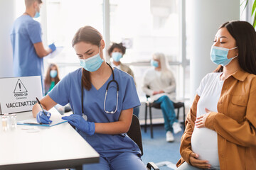 Wall Mural - Pregnant Lady In Mask On Appointment At Doctor's Office