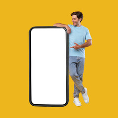 Poster - Man pointing at big white empty smartphone screen, mock-up