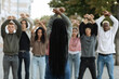 © Prostock-studio - Unrecognizable long-haired black woman leading group of protestors
