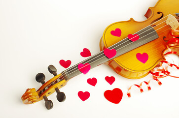 Wall Mural - Violin and red hearts on a white background. Symbol of love.