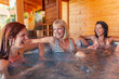 © Impact Photography - Girl friends relaxing in hot tub while on vacation