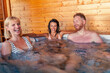 © Impact Photography - Friends relaxing and having fun in hot tub