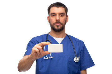 Sticker - healthcare, profession and medicine concept - doctor or male nurse in blue uniform with box over white background