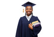 © Syda Productions - education, graduation and people concept - happy graduate student woman in mortarboard and bachelor gown with books over white background