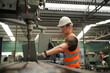 © FotoArtist - Industrial Engineers in Hard Hats.Work at the Heavy Industry Manufacturing Factory.industrial worker indoors in factory. man working in an industrial factory.