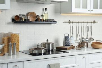 Poster - Countertop with different cooking utensils in kitchen