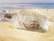 Sailing Boat In Corked Glass Bottle Washed Ashore
