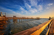 Line of wooden docks into Galveston Bay