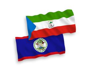 National vector fabric wave flags of Republic of Equatorial Guinea and Belize isolated on white background. 1 to 2 proportion.