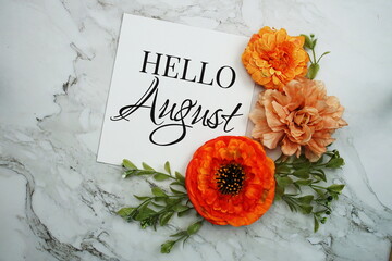 Canvas Print - Hello August text with orange flower bouquet on marble background