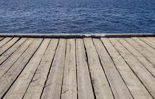 The Line Between A Plank Pier And Water. Beautiful Background.