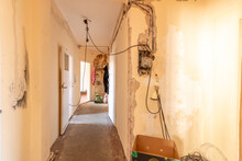 Dirty, Simple Hallway, During Renovation, With Electricity Cables Outside.
