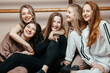 © Кирилл Горшков - Cheerful women-girls in sportswear, sitting against the wall, ready to start fitness classes, the concept of a healthy sports lifestyle. Generation Y concept