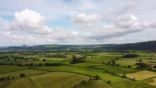 Drone Hyperlapse Over Patchwork Fields In North York Moors With Clouds