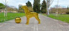 Green Park With A Sphere And Statue Of A Dog With Gold Texture