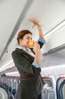 © Kostiantyn - Stewardess demonstrating how to use oxygen mask in aircraft