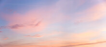 Light Blue And Pink Pastel Colored Panorama Sky With Clouds