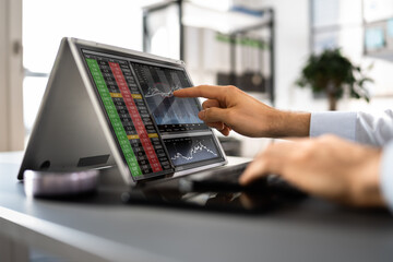 Poster - Close-up Of A Stock Market Broker's Hand Looking At Graphs