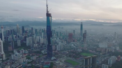 Wall Mural - Aerial drone cinematic b-roll shot of highest building in Malaysia during sunrise