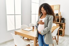 Young Latin Woman Pregnant Smiling Confident Working At Office