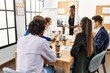 © Krakenimages.com - Group of business workers listening african american boss woman conference at the office.