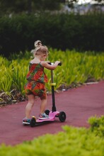Little Child Riding A Scooter In Madeira Portugal