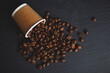© onderortel - Coffee beans spilling from cup on granite