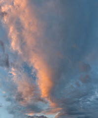 Wall Mural - Russia. The South of Eastern Siberia. Gloomy sunset clouds in the evening summer sky over the mountain ranges of Eastern Sayan.