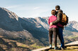 © ADDICTIVE STOCK - Couple of hikers admiring view of mountains