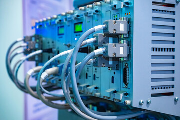 Poster - data center equipment close up. gray data center equipment with network cables. telecommunication ce