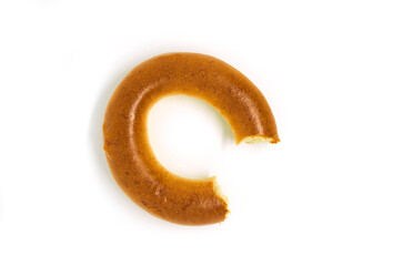 A bitten bagel isolated on a white background