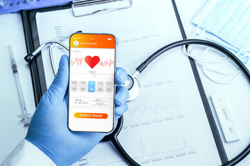Doctor online medical application. Doctor holding digital smartphone. Healthcare medicine app on mobile phone screen. Mobile medicine, online doctor.