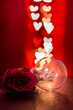 Light bulb and rose with heart shaped bokeh lights background