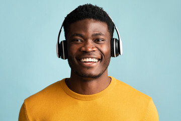 Wall Mural - Happy african american man with headset, closeup shot