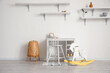 © Pixel-Shot - Workspace, modern lamp and rocking horse near light wall in child's room